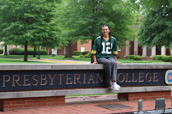 Vanessa Palison '26 in a Green Bay Packers jersey on the Vance Plaza at Presbyterian College in Clinton, S.C.