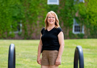 Lisa Stewart poses for a photo in the Academic Quad.