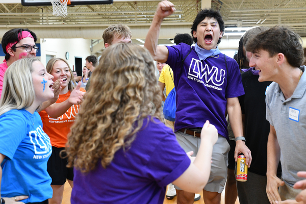 Lindsey Wilson University New Student Orientation leader Luke Popplewell ’29 of Russell Springs, Kentucky, center, celebrates Alden Brumley ’30 of Russell Springs, right, who defeated Jaydelynn Woodall ’27 of Science Hill, Kentucky, in purple T-shirt left, in the final round of a rock, paper, scissors hand game held among orientation leaders and new students on Saturday, June 6, in the Doris and Bob Holloway Health & Wellness Center. More than 350 new students and their guests attended the first two sessions of the university’s orientation for new students, held June 5-6.