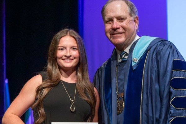 Representation of the achievement named 'Malia Dake Honored by Hartwick College'.