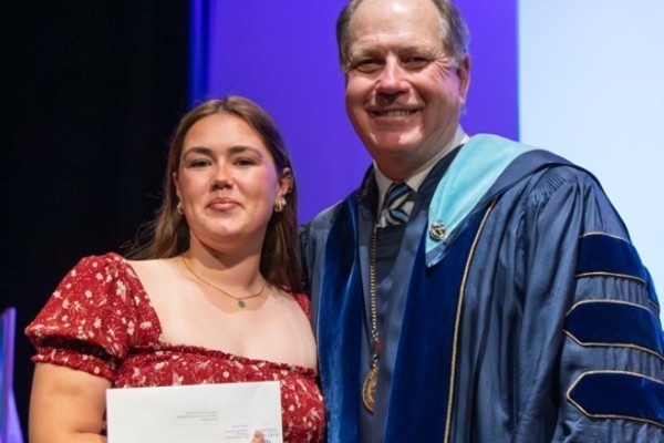 Representation of the achievement named 'Lily Dempsey Honored by Hartwick College'.