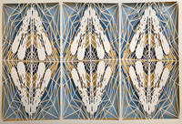 Framed artwork of intricate, hand-cut paper.