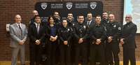 Graduates of the Spring 2026 police academy at SUNY Potsdam's Law Enforcement Training Institute gather for a photo.
