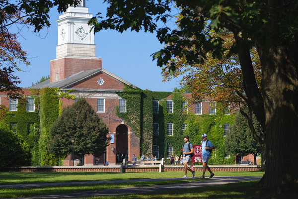 Students walk across SUNY Potsdam's Academic Quad in the spring.