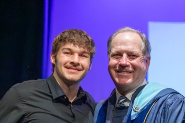 Representation of the achievement named 'Michael Gitz Honored by Hartwick College'.