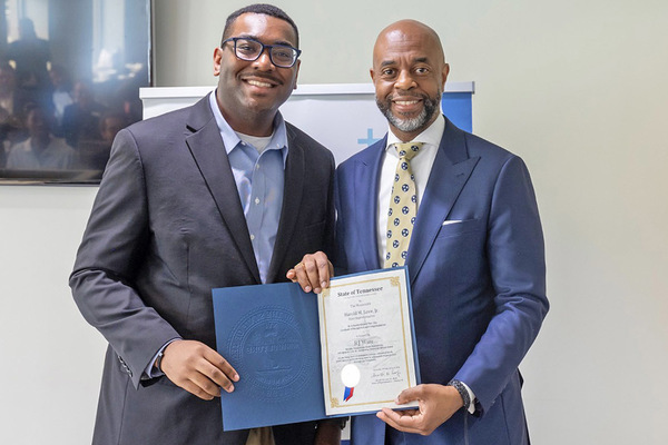MTSU grad student R.J. Ware of Hermitage, Tenn., accepts Harold Love Outstanding Community Service Award.