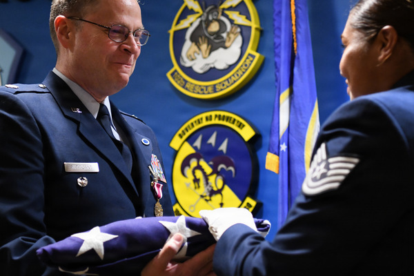 New York Air National Guard Lt. Col. Michael Rutigliano, a Melville resident, receives a folded American flag during his retirement ceremony at Francis S. Gabreski Air National Guard Base in Westhampton Beach, New York, June 6, 2026. Rutigliano retired after 30 years of dedicated service with the 102nd Rescue Squadron, assigned to the 106th Rescue Wing. (U.S. Air National Guard photo by Technical Sgt. Sean Madden)