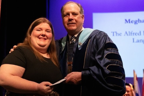 Representation of the achievement named 'Meghan Harrington Honored by Hartwick College'.