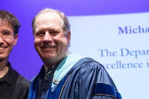 Representation of the achievement named 'Michael Kuchinski Honored by Hartwick College'.