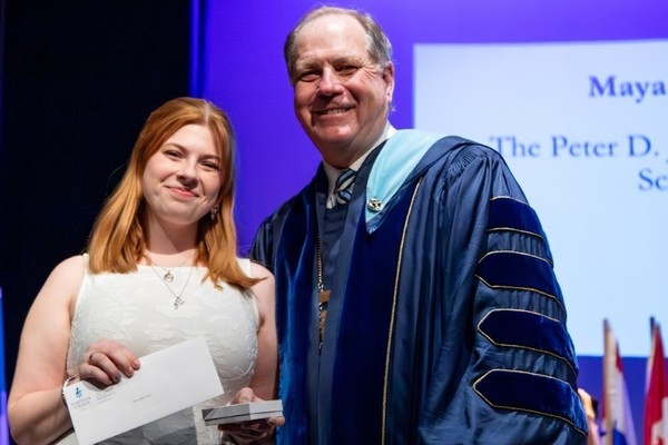 Representation of the achievement named 'Maya MacCarthy Honored by Hartwick College'.