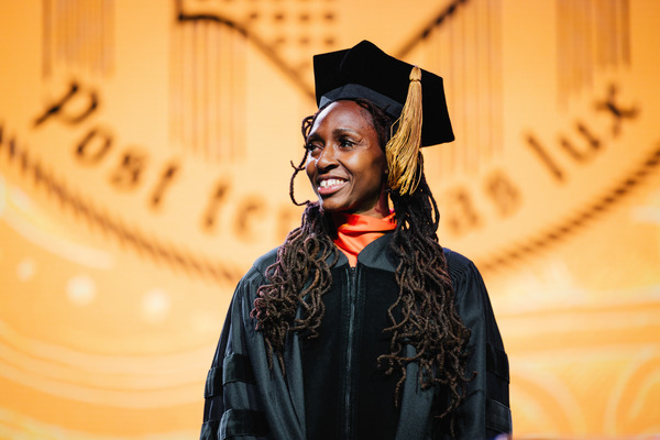 Alumna and Paralympian Femita Ayanbeku Bradley ’14 addressed graduates at AIC’s 2026 Commencement Ceremony
