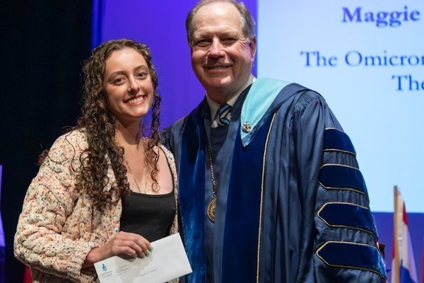Representation of the achievement named 'Maggie Van Valkenburgh Honored by Hartwick College'.
