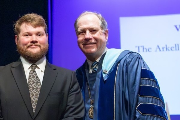 Representation of the achievement named 'Vaughn Wagnecz Honored by Hartwick College '.