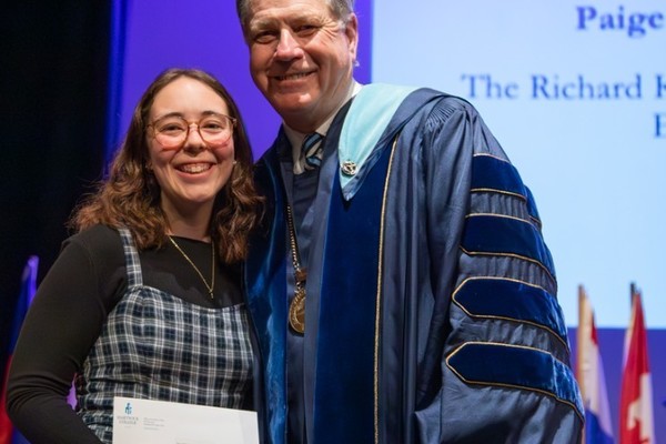 Representation of the achievement named 'Paige Witherbee Honored by Hartwick College'.