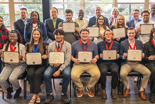 Representation of the achievement named 'Political Science and Economics Students Inducted into Honor Society'.