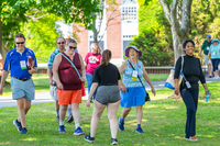 Reunion guests smile while taking a tour of campus updates at SUNY Potsdam.