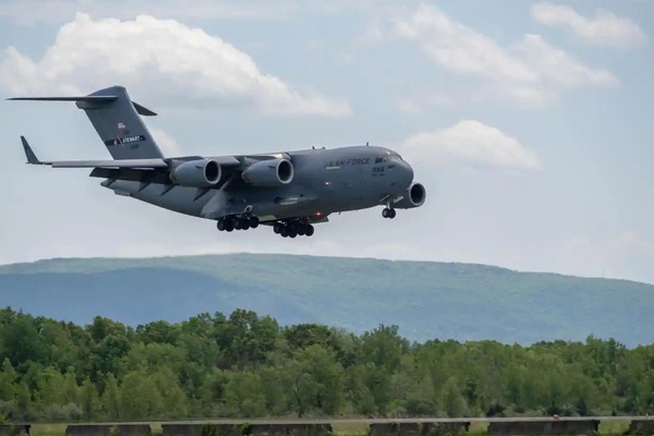 A C-17 Globemaster III strategic airlifter flown by the New York Air National Guard's 105th Airlift Wing comes in for a landing at Stewart Air National Guard Base in Newburgh on May 22, 2026. One of these planes will participate in the 150 plane International Air Review slated to take place on the morning of July 4, 2026 to celebrate the 250th year of the United States' independence. (U.S. Air National Guard photo by Staff Sgt. Sarah Post.)