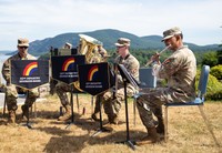 Band playing with Hudson River in the background.