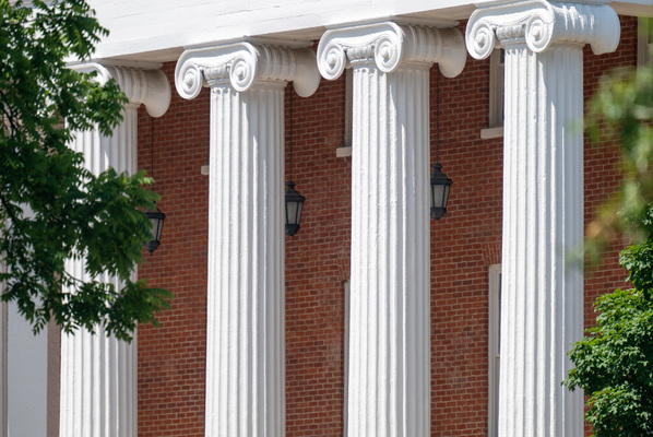 Image of four ornate columns on a building.