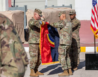 Soldiers furling the flag 