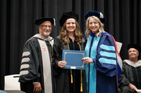 Elizabeth Travis receives the Milton W. Garfunkel Award from Sherman President Dr. Jack Bourla and Executive Vice President Dr. Karen Canup.
