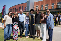 A family celebrating with a Sherman graduation following the commencement event.