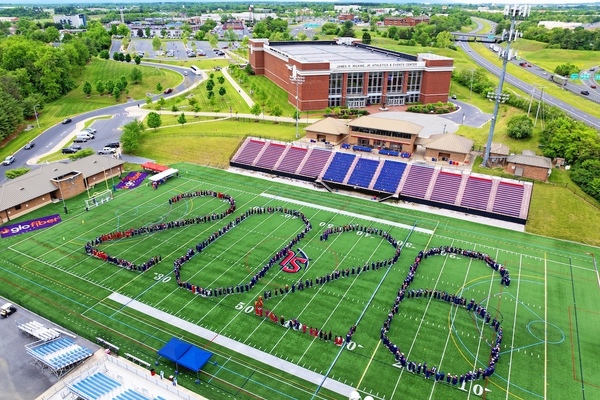 Aerial photo of Shenandoah University graduates forming "2026" on the football field.