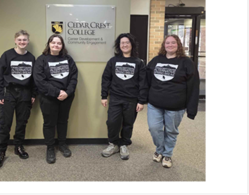A group of four students wearing matching sweatshirts for our alternative spring break, In the Valley for the Valley.