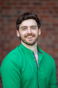 Max Grube poses for a photo on the SUNY Potsdam campus.