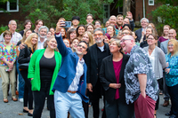 A large group selfie with Chuck Lorre at the center.