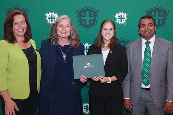 Representation of the achievement named 'Jillian Stahl accepts SRU's ASSP Student Section of the Year Award'.
