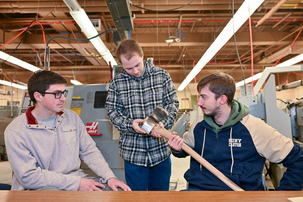 Cut Above - SUNY Canton students Nathan St. Louis of Plattsburgh, Matthew Gattus of Jeffersonville and Mitch Timerman of La Fargeville placed fourth in a Forging Industry Educational and Research Foundation (FIERF) competition for their handmade American Felling Axe.