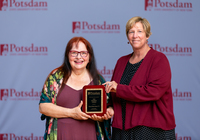 Karen Butler Easter accepts the Minerva Award from SUNY Potsdam President Suzanne Smith.