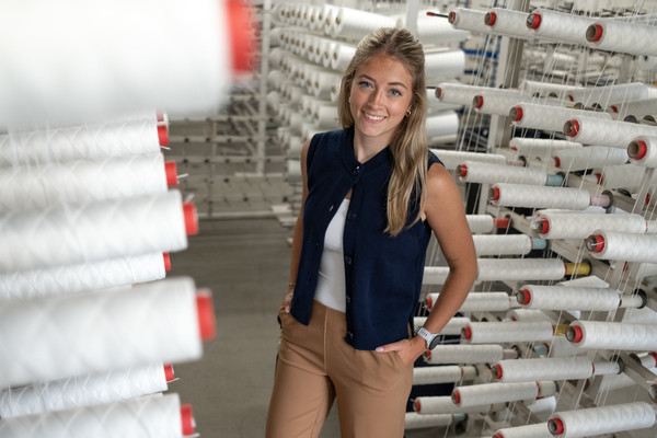 Elise Cacchione, a senior communication major at PennWest Edinboro, creates social media content as part of her internship with Snap-tite Hose.