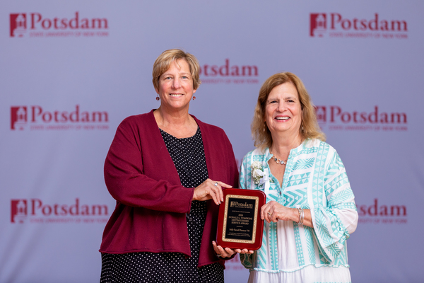 Sally Farrell Partner ’78 of Rochester, N.Y., seen at right, is the recipient of the 2026 Donald L. Tompkins Distinguished Service Award from SUNY Potsdam’s Alumni Association. SUNY Potsdam President Dr. Suzanne Smith (left) presented the award at Reunion 2026.