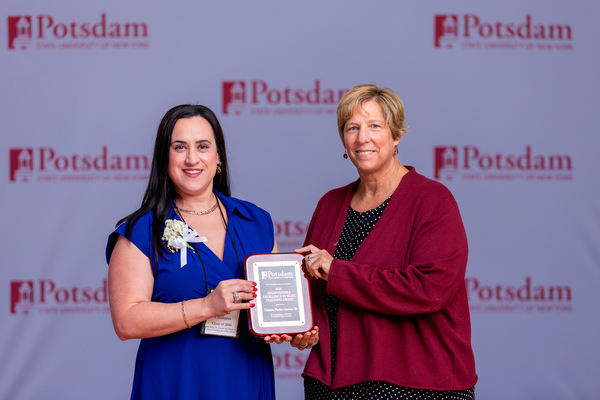 Christina Pizzino-Catalano ’06 (left) of Glenville, N.Y., is the recipient of the 2026 Helen M. Hosmer Excellence in Music Teaching Award from the Julia E. Crane Alumni Association at SUNY Potsdam’s Crane School of Music. She is seen here after accepting the award from SUNY Potsdam President Dr. Suzanne Smith (right) at Reunion 2026.