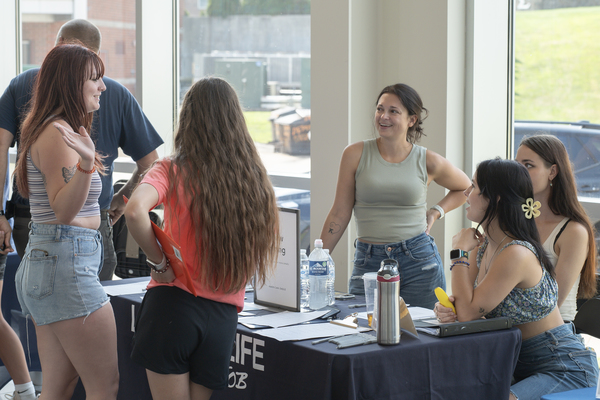 Trine University students discuss job opportunities with representatives from American Eagle at a past Part-Time Job Fair. Local businesses who want to recruit students for positions are encouraged to register for this year's fair, which will be held Sept. 2. 