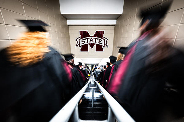Graduates enter the coliseum for commencement at MSU.
