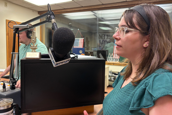 Natalie Reynolds speaks into a microphone as part of her internship with the Pennsylvania Department of Transportation. 