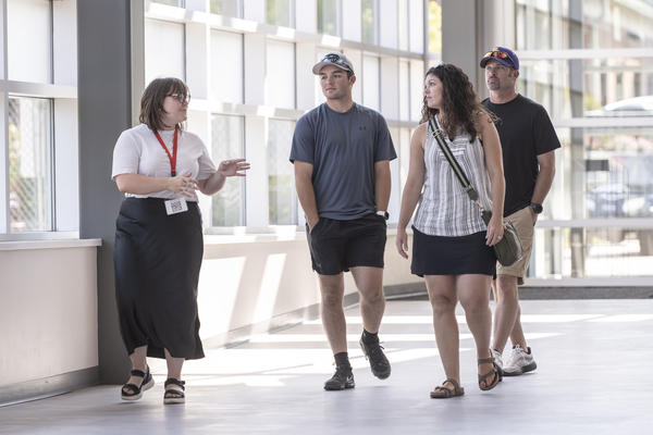 A Trine University student leads a family on a tour of campus in this file photo. The university will welcome visiting students with themed spirit days and giveaways as part of Indiana Private College Week, July 20-24. (Photo by Dean Orewiler / Trine University)