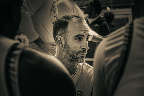 Brian Oleksiak '14 addresses starting lineup during pre-game warmups in Thomas Filedhouse prior to taking on Slippery Rock University on Feb. 6.