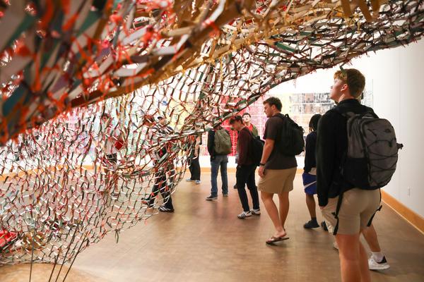 Students from Professor Anne Bost's Enduring Questions class visited the gallery of Artist in Residence Akindiya Akirash and had a chance to interact with the artist.