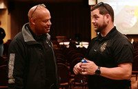 Talking, police, two people, taser cartridge