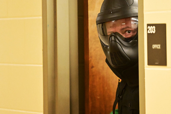 Northeast Mississippi Community College Police Officer Gary Edwards peers into a hallway while clearing Patterson Hall during an active shooter response exercise as part of a multi-day school safety training on the college's Booneville campus. More than 35 law enforcement officers from agencies across northeast Mississippi participated in the training, which combined classroom instruction with realistic ALERRT-based scenarios designed to strengthen communication, tactical movement, casualty care and coordinated responses to emergencies in educational settings.  