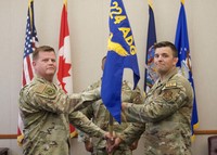 Air Guard officers swapping guidon.