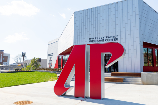 AP statue in front of O'Malley Family Welcome Center