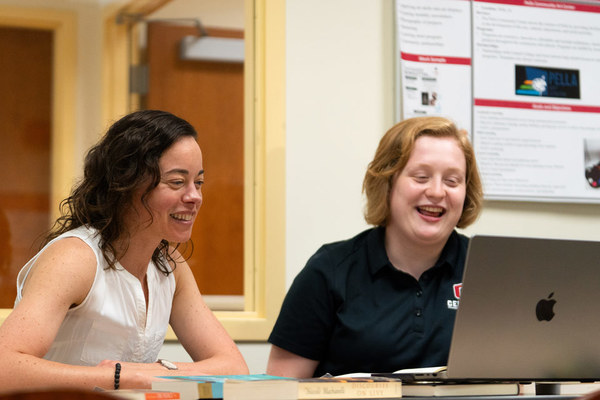 Valerie Billing, associate professor of English, discusses a literature research project with Elyse Shaw '27.