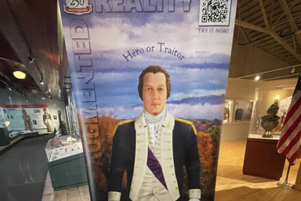 This banner of Benedict Arnold, the hero of the 1777 Battale of Saratoga, who later turned traitor  to the American cause, lets visitors to the New York State Military Museum in Saratoga Springs, New York, learn about his story when they use their phone to scan a QR code. Four of these banners are now part of the exhibit at the museum which is run by the New York State Division of Military and Naval Affairs. 