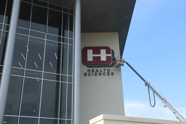 The Hinds Community College "H" was installed on the school's new Health Sciences Complex using a crane on Aug. 5, 2026, just in time for the start of classes on Aug. 10. The building will be dedicated on Oct. 7. It is the largest construction project ever taken on by the college. 