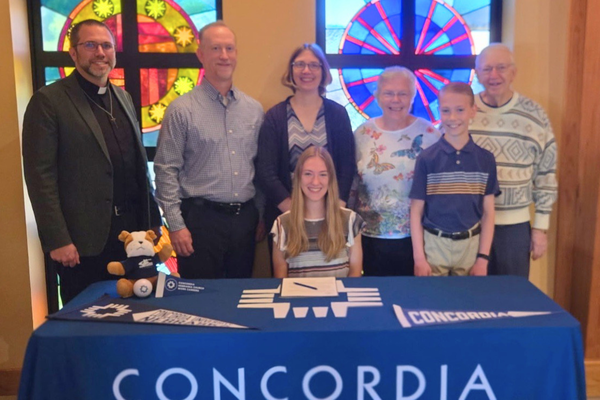 Alyssa Bivens (Lutheran Teacher Diploma, Troy, Illinois) signing her Concordia University, Nebraska Church Work Letter of Intent.